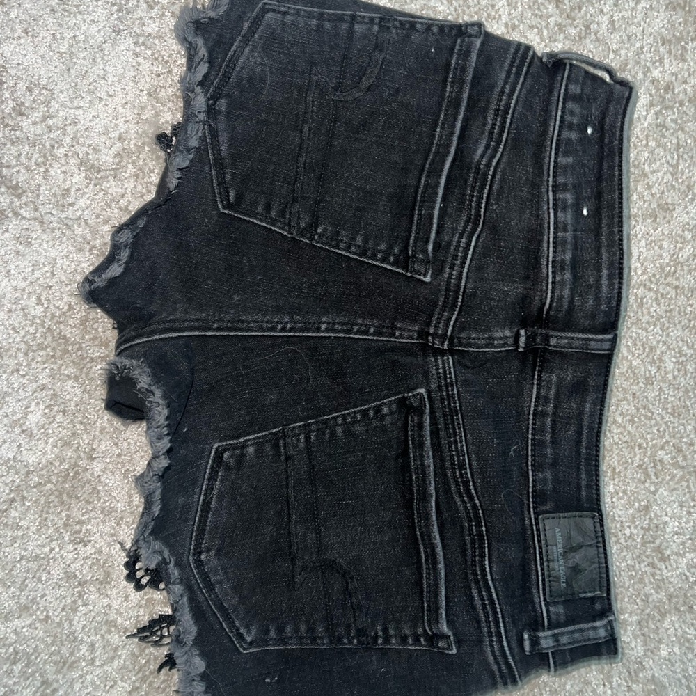 american eagle black jean shorts with‎ crochet detail
